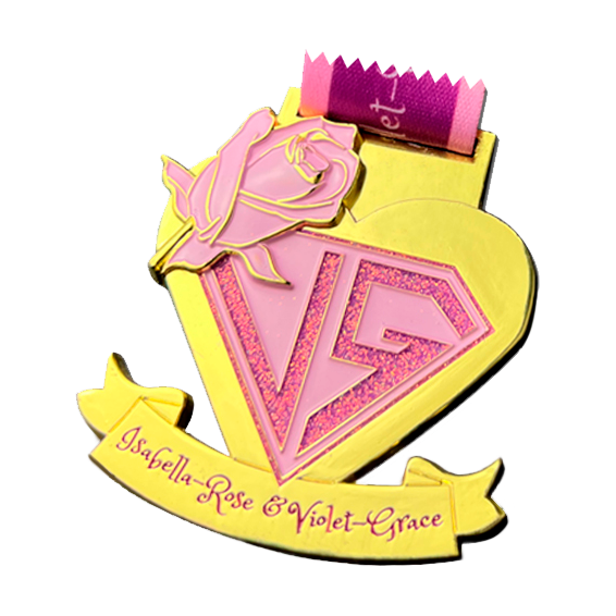 Metal medal with glitter application