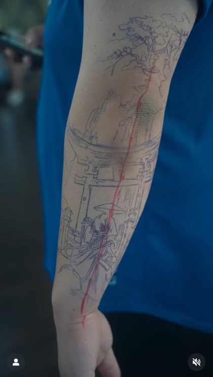 Hand prepared for tattooing, shaved and with the design transferred