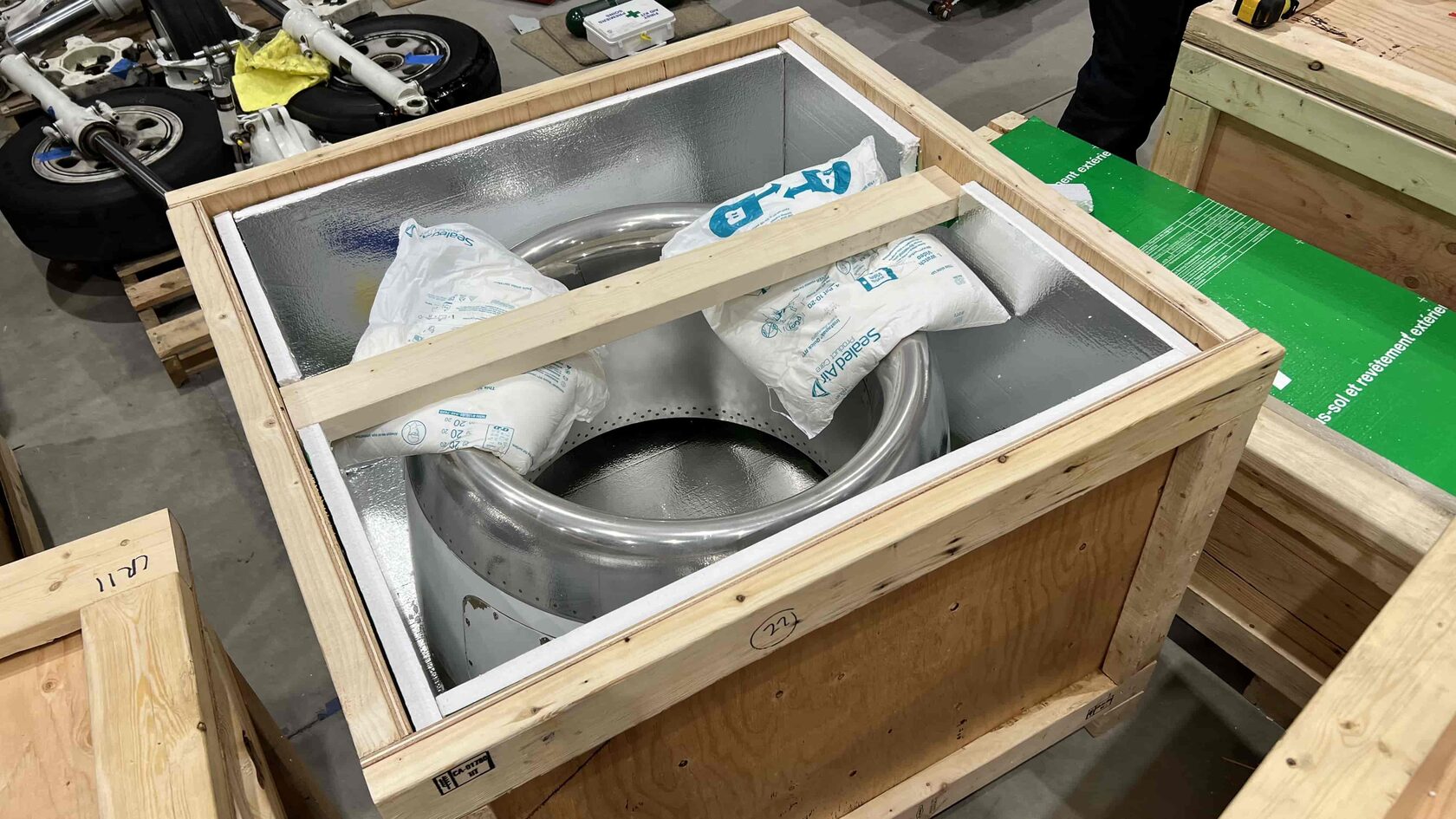 Custom foam-lined crate interior with engineered blocking for aerospace component shipping