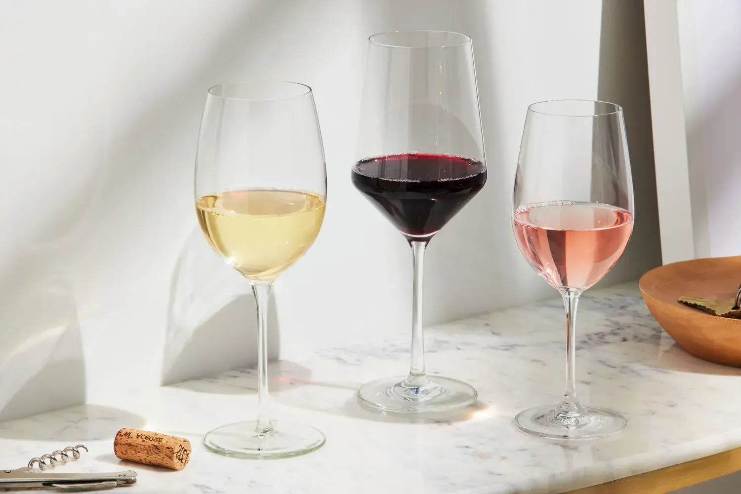 A beautifully set table with the proper glasses for enjoying red and white wine in Bali.