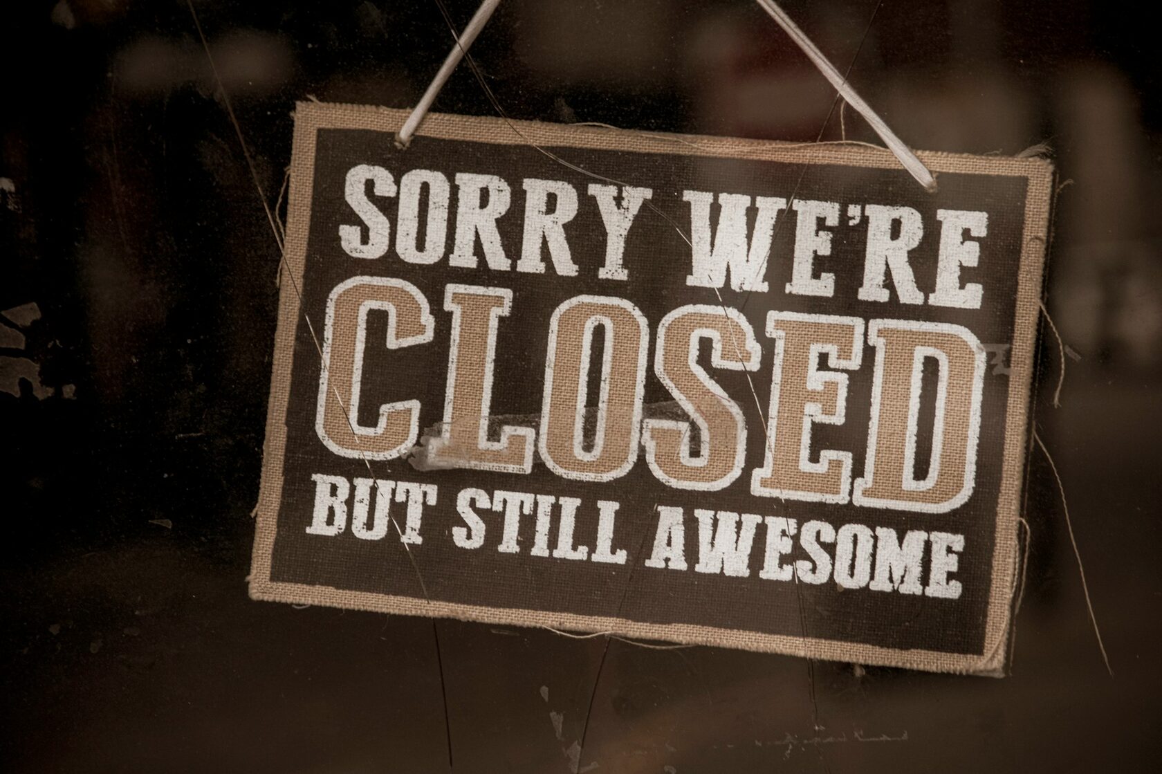 We're closed but we're still excellent sign