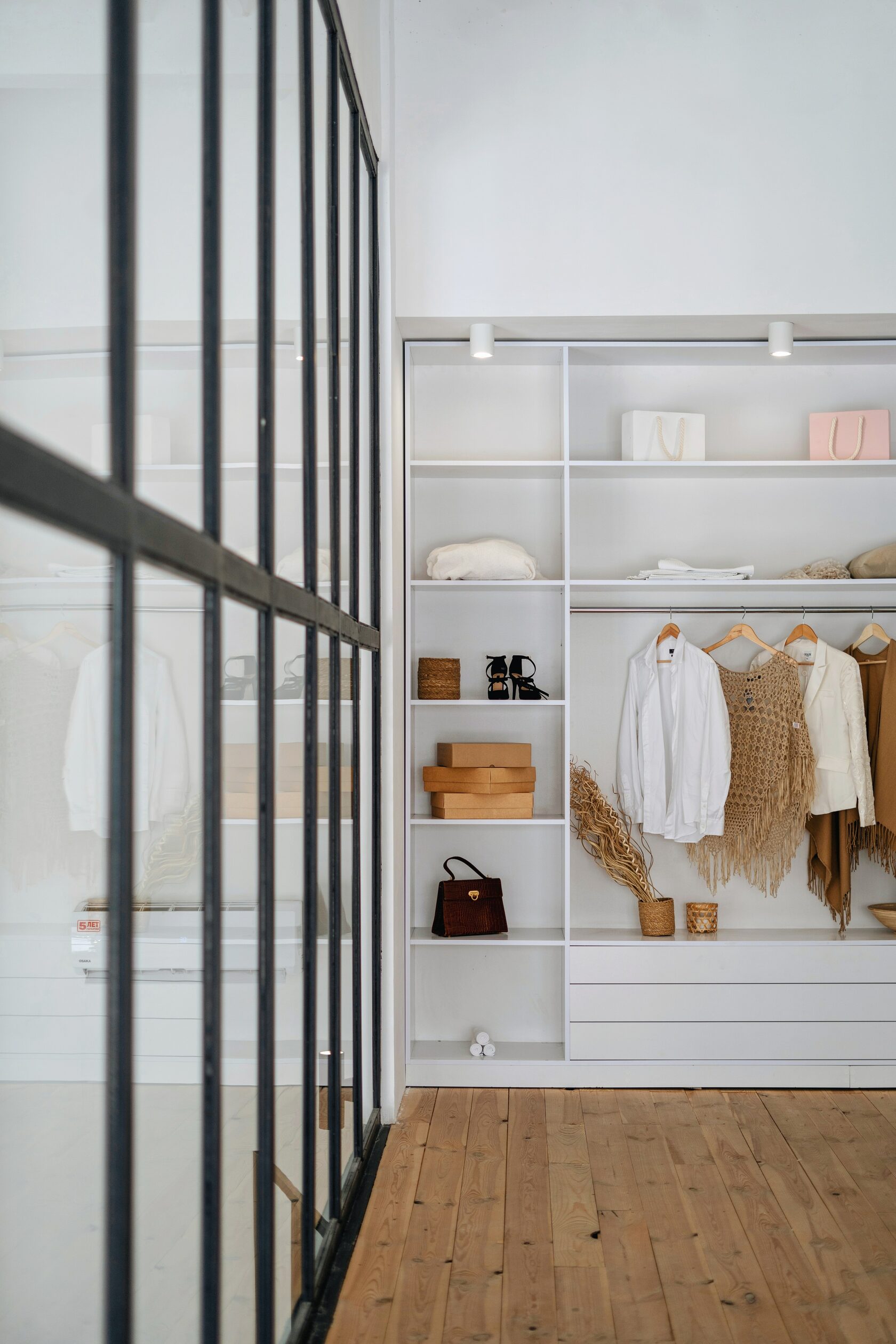 Organised wardrobe with clothes and handbags