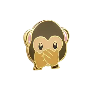 металлический значок в виде мартышки
