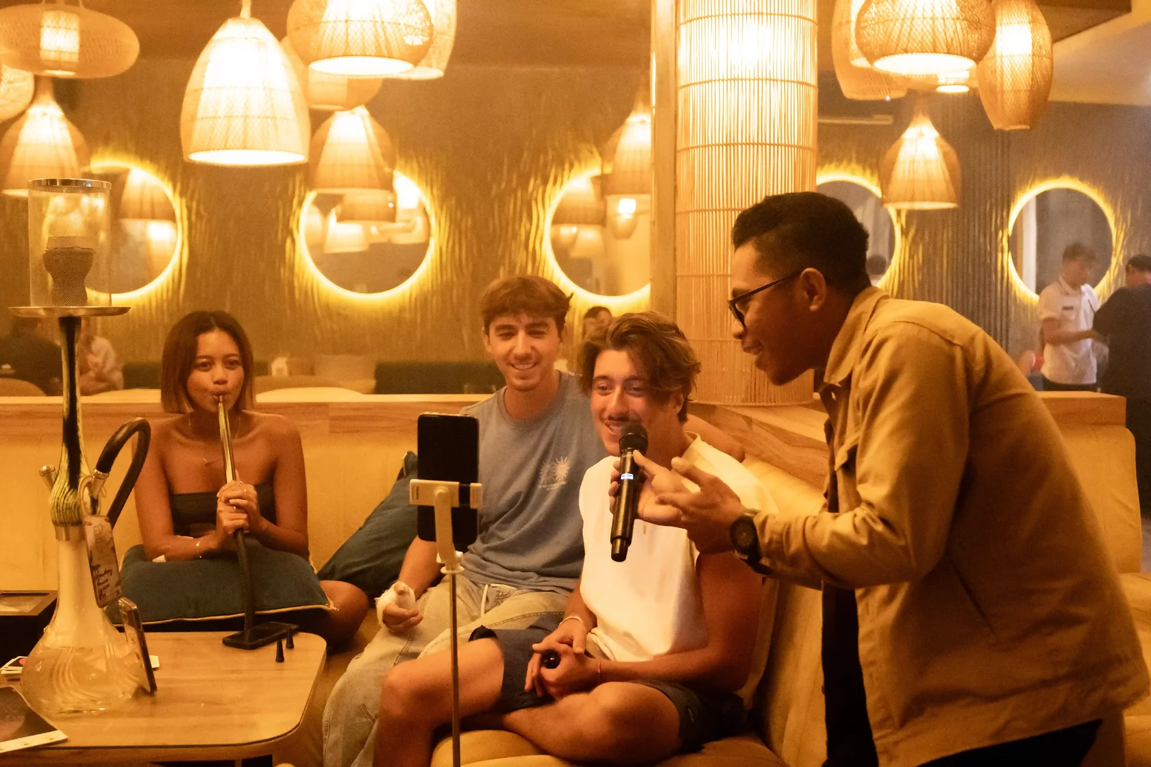 Friends enjoying shisha and a relaxed evening at a Bali lounge
