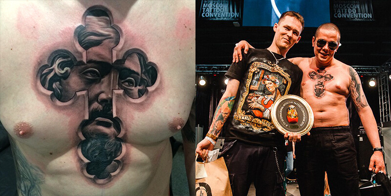 A unique black and grey 3D effect chest tattoo of Jesus Christ's face seen through a cross-shaped cutout, shown alongside the artist Rinat Tattarin Mingazdinov and client holding an award at the International Moscow Tattoo Convention