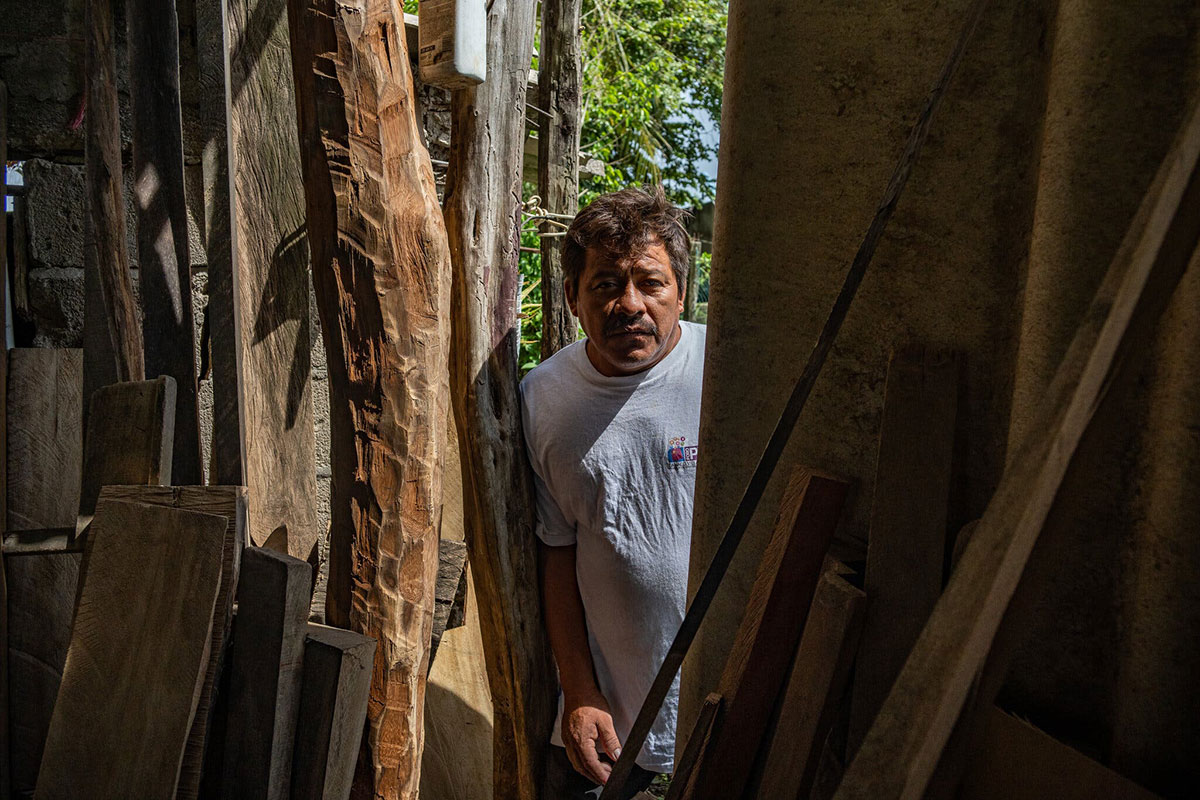 Pedro García Hernández works as a carpenter in a tiny workspace inside the home he shares with his wife and daughter in a rainforest-shrouded region of Mexico. Alejandro Cegarra for The New York Times