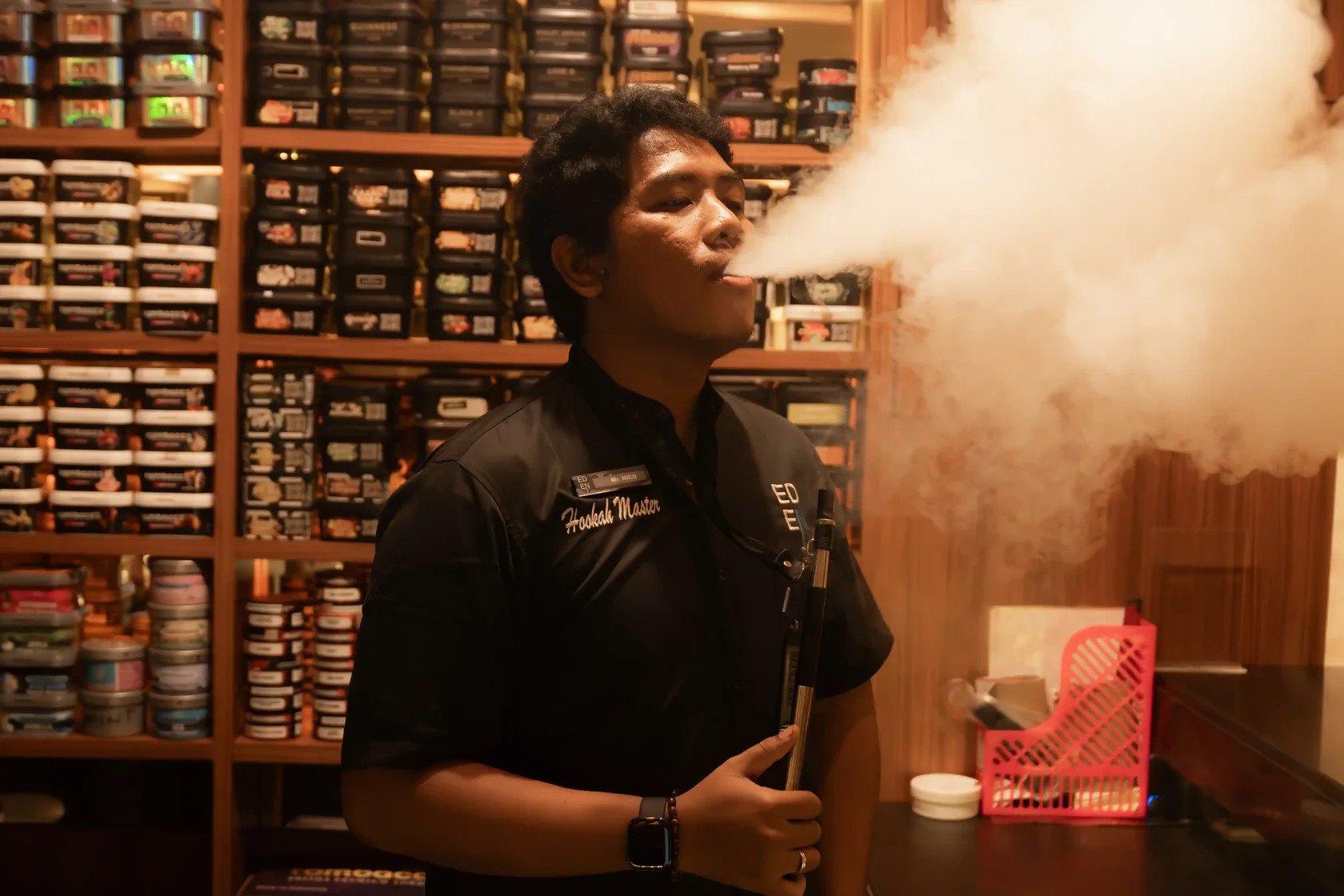 Eden hookah master preparing shisha with a wide selection of tobacco flavours
