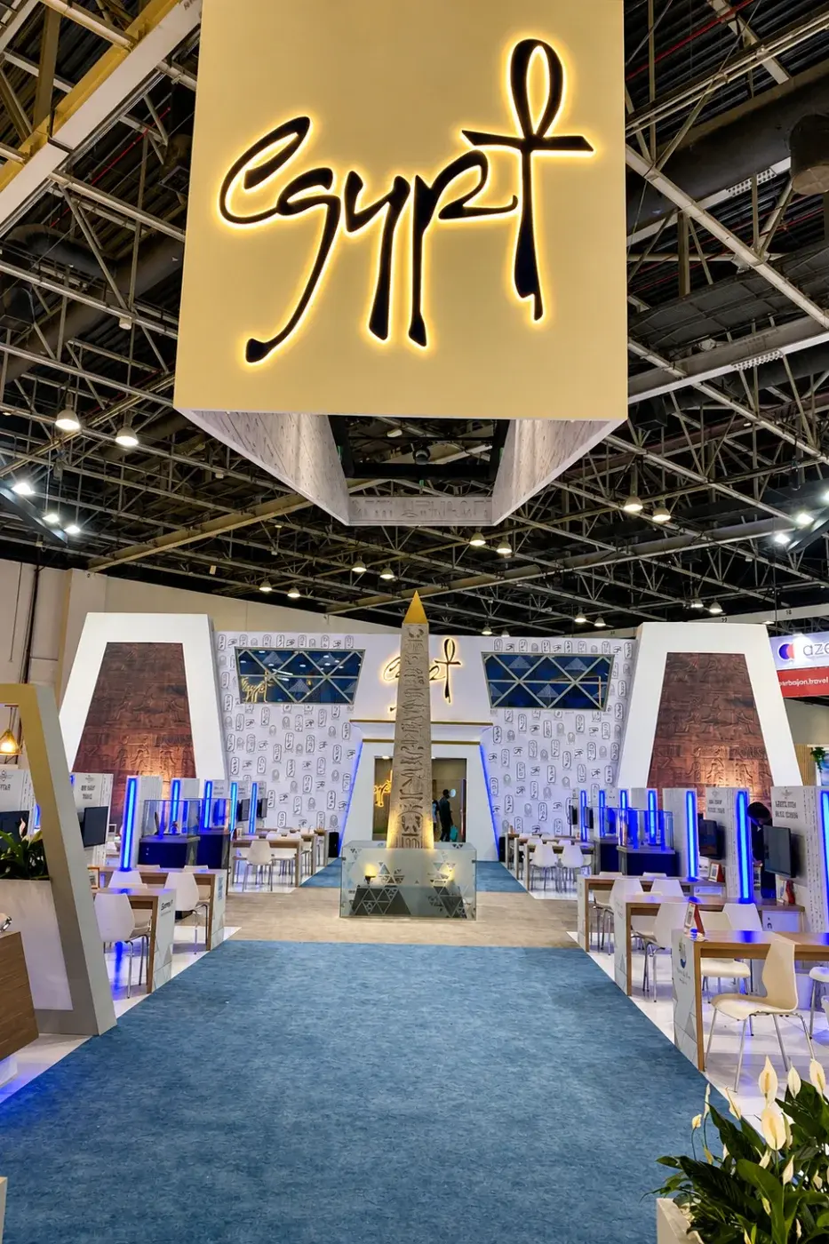 Exhibition stand with a raised canopy and a central display piece