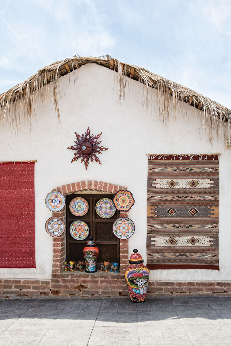 An adobe gallery adorned with ceramics and woven rugs in Todos Santos.