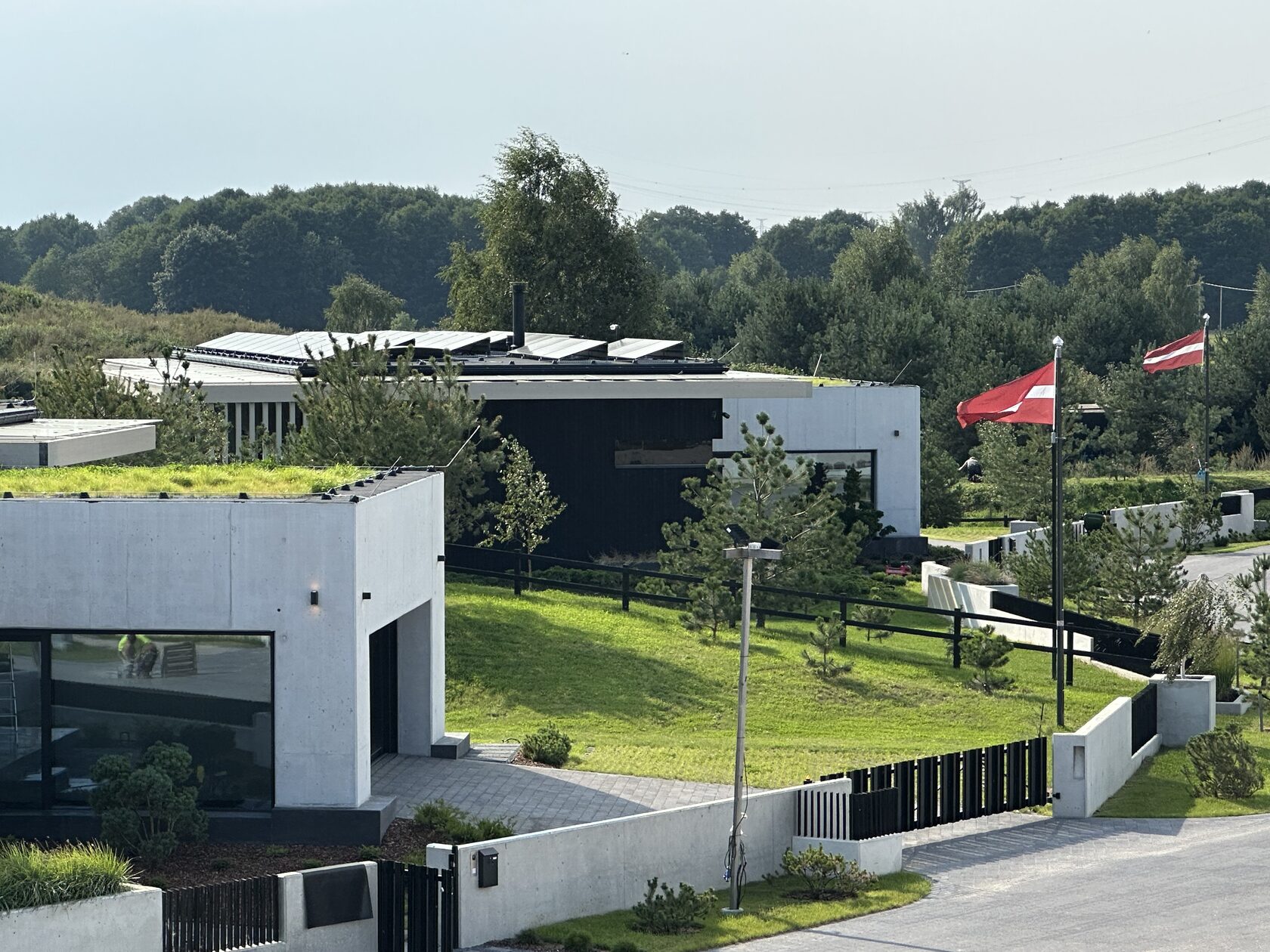 Exterior look of two first line villas from above in the afternoon light