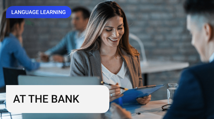 An attractive woman sitting and  smiling at the business meeting in a bank