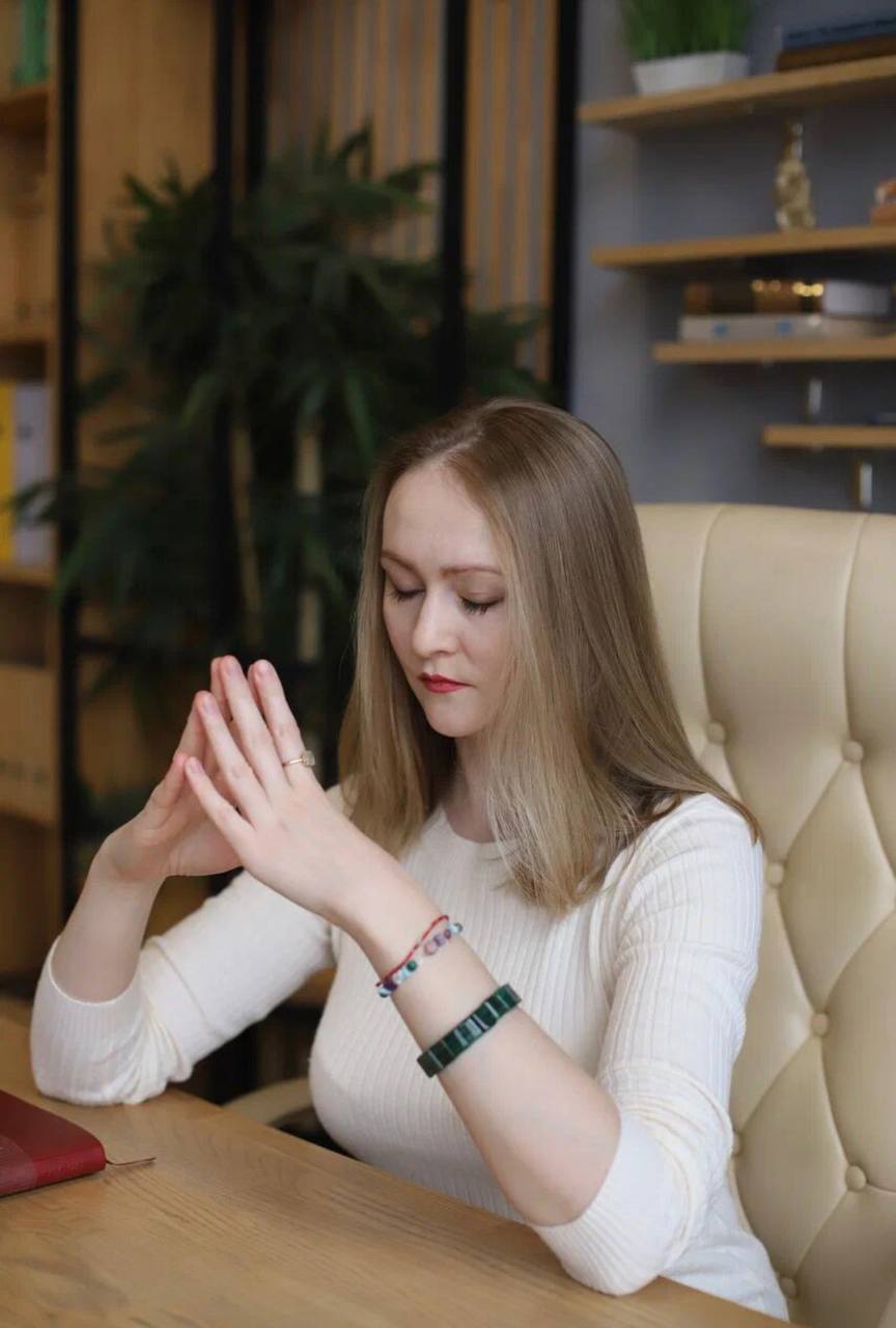 Portrait of the psychologist and manager, a woman with a warm and confident smile
