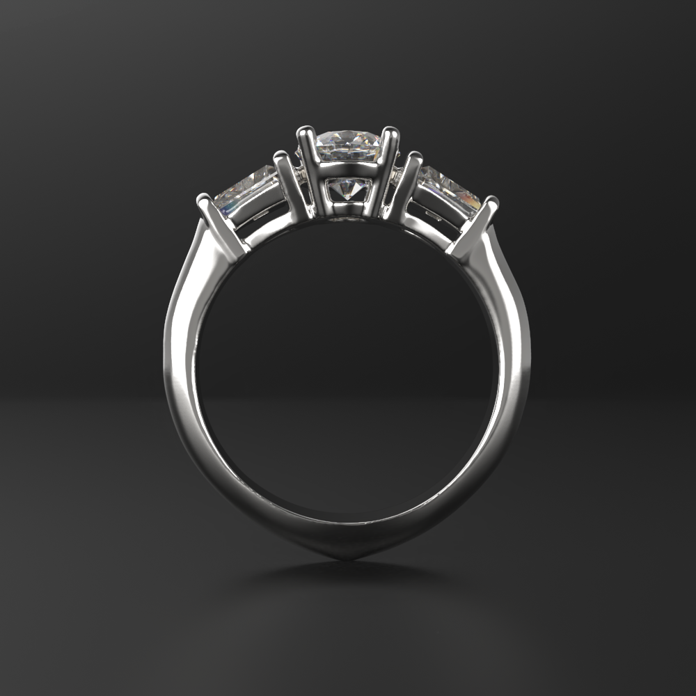 Кольцо из белого золота с двумя боковыми бриллиантами трапецевидной формы. Центральный бриллиант 0,5кт. В нижней части кольца сделан утяжелитель для баланса на пальце.