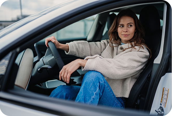 Woman driving an electric car