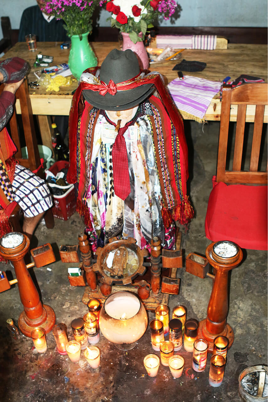 The statue of Maximón. His images in various forms, including in smaller sculptures, can also be purchased on the market – as a rule, this saint is approached for money, problem solving or to help win a woman's heart. Santiago Atitlan, Solola Department, 2018.
