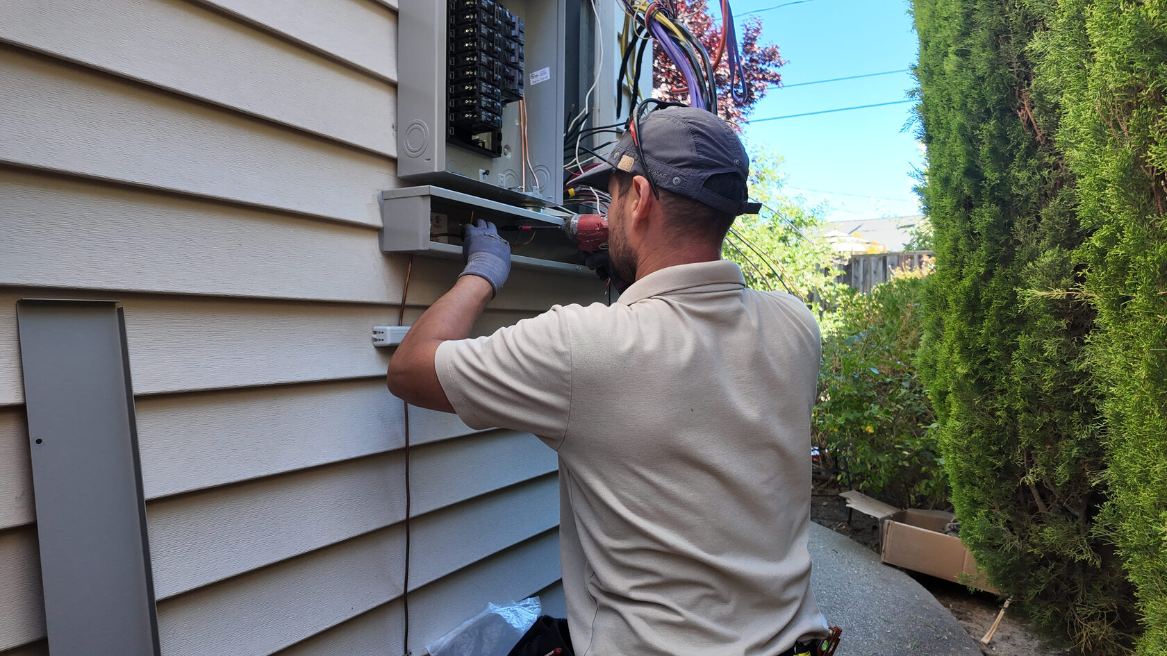 Technician who knows how to install a wall sconce light fixture