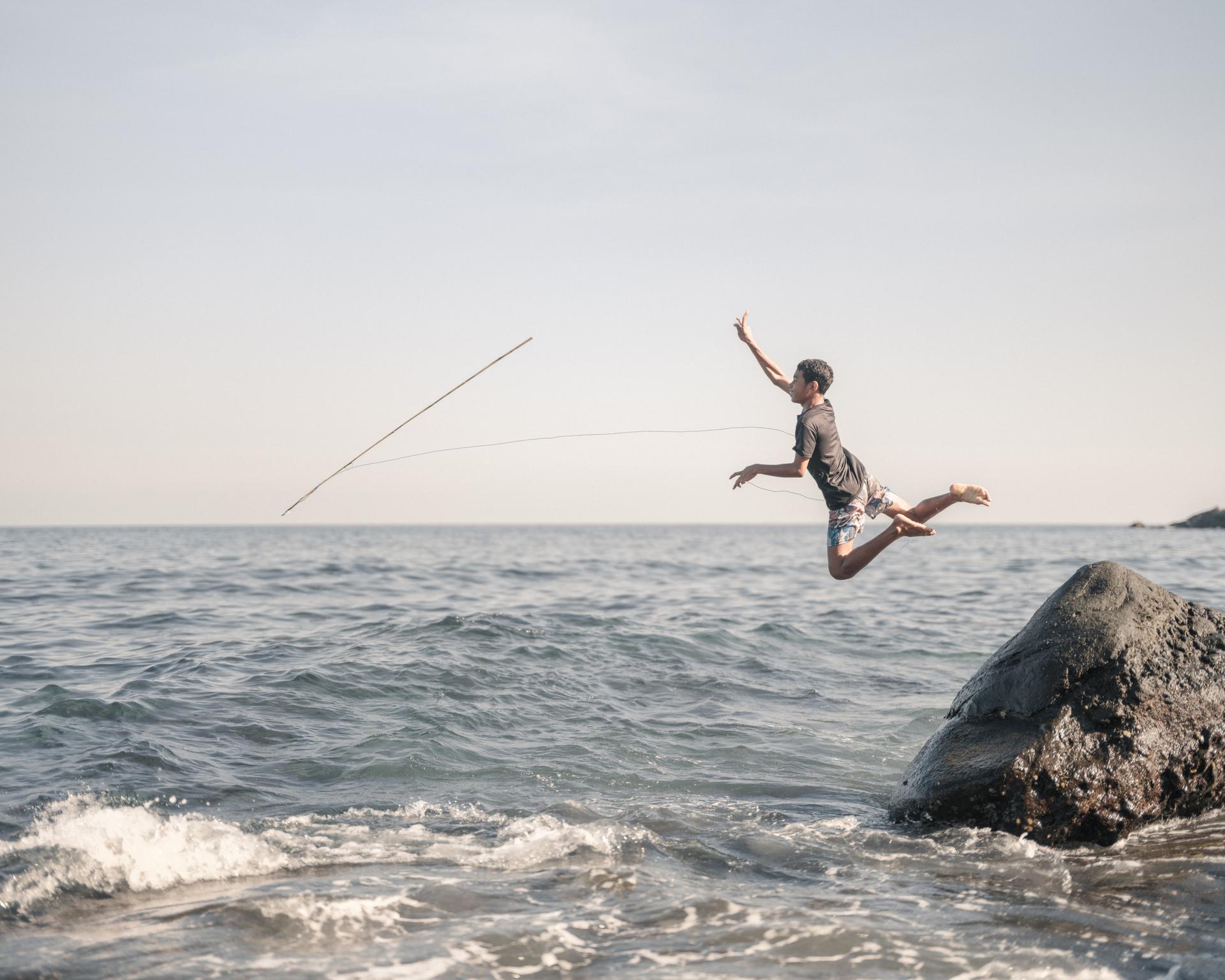 Indonesia | Tianxiao Wang. Sixteen-year-old Emen practises traditional whaling techniques by repeatedly diving from coastal cliffs into the sea.