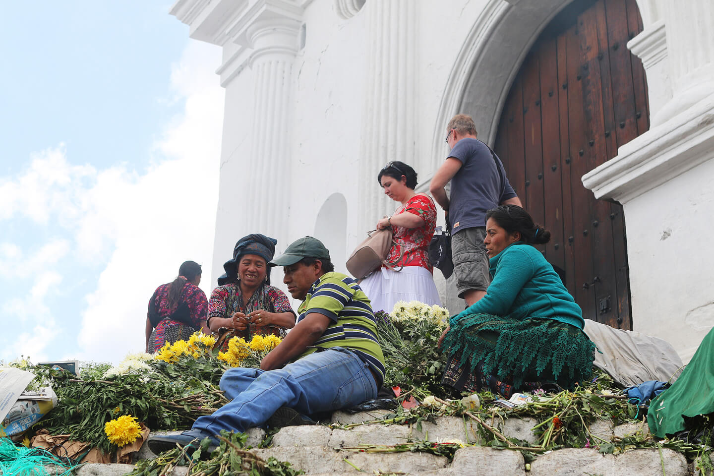Flowers are sold on the steps of Santo Tomás church. They are used for rituals, holidays and home decoration. Chichicastenango, Quiché Department, Kʼicheʼ tribe. 2018.