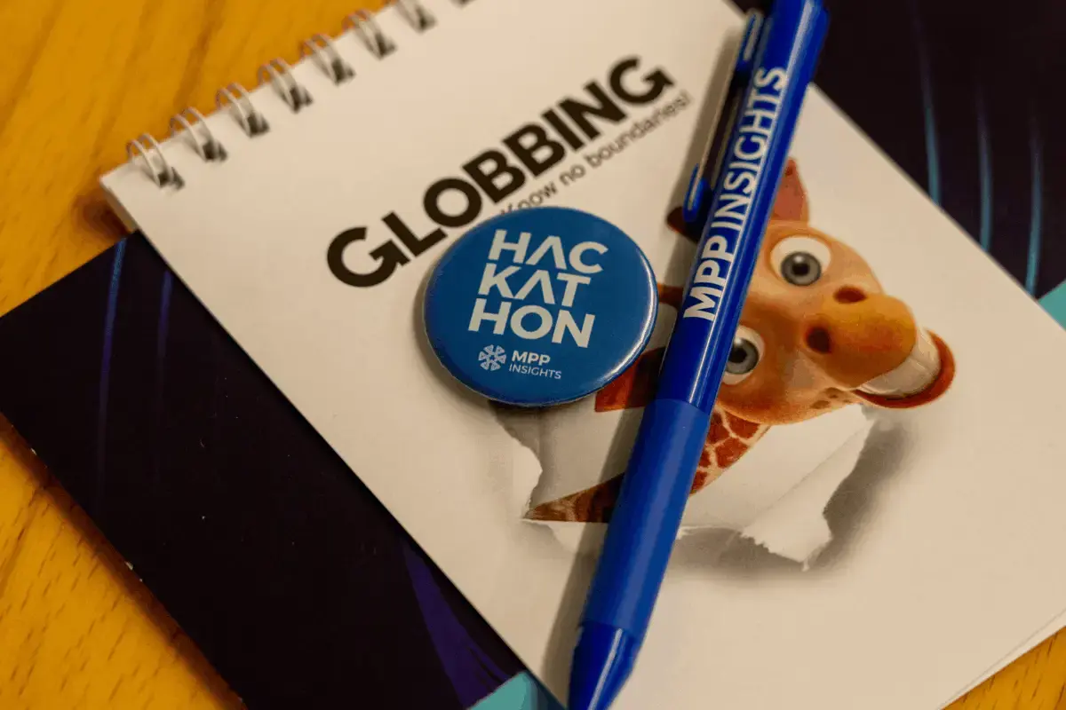 Participant swag including notebook, pen, and gifts from MPP Insights and Globbing at LLM 4 ETL Hackathon 2025 in Yerevan, Armenia