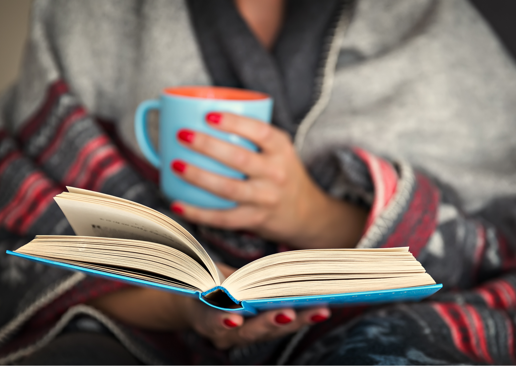 She is reading a book