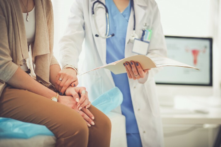 doctor looking at patient