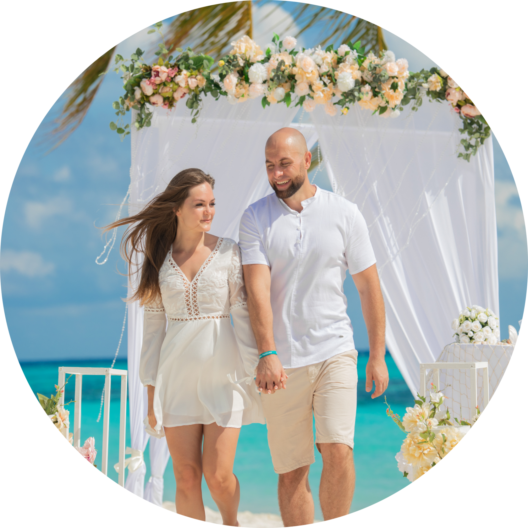 couple on the background of the wedding arch