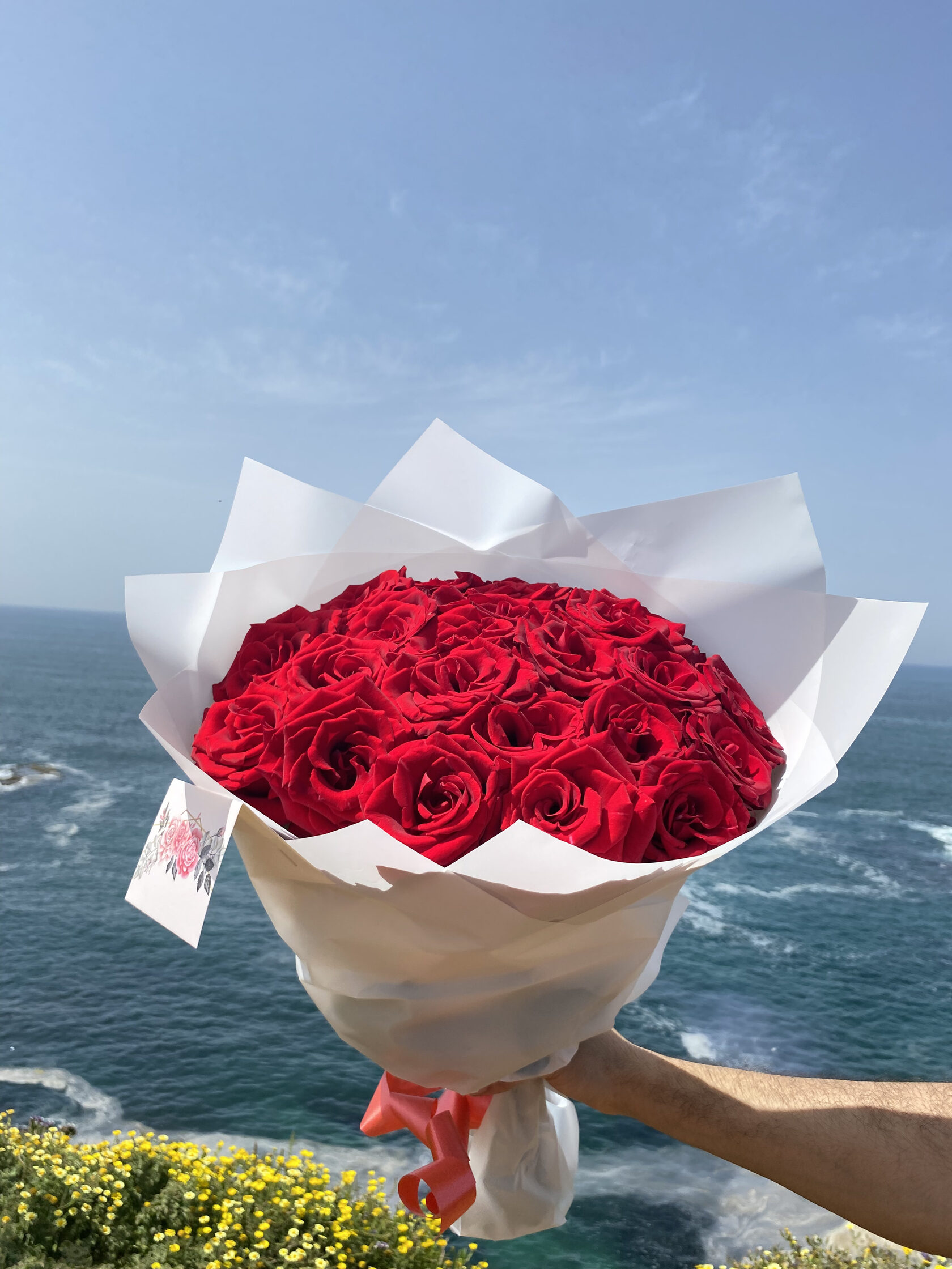 Luxury red rose bouquet by the ocean for romantic flower delivery in Rabat Morocco