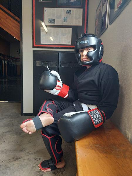 Eddie Fischer - Sparring Gear new white belt the Pit Martial Arts. Eddie is waiting for class to begin.