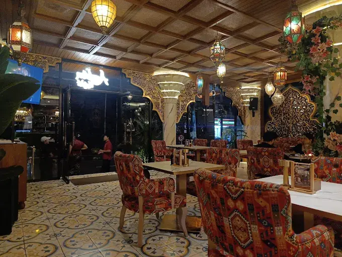Authentic Middle Eastern interior featuring colorful hanging lanterns and patterned seating at Arabian Knight Ubud, adding cultural richness to the best shisha lounge in Bali scene.