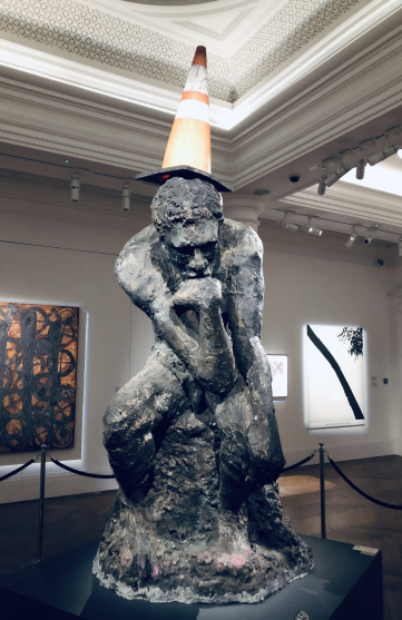 The Thinker, with a traffic cone on its head by Banksy on the auction in Sotheby's
