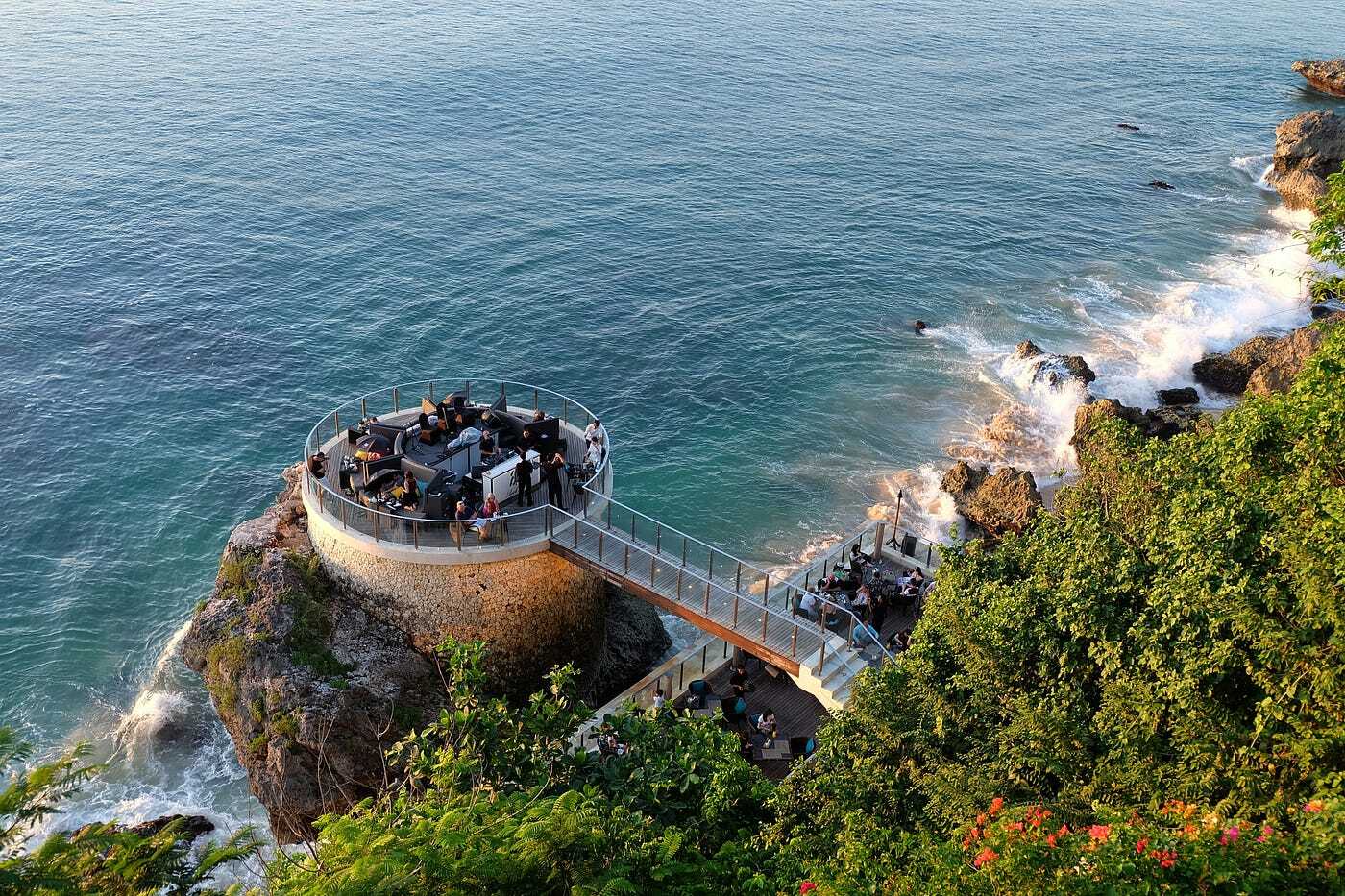 Round open-space premises sitting on the cliff above the coast line of one of the Bali beaches
