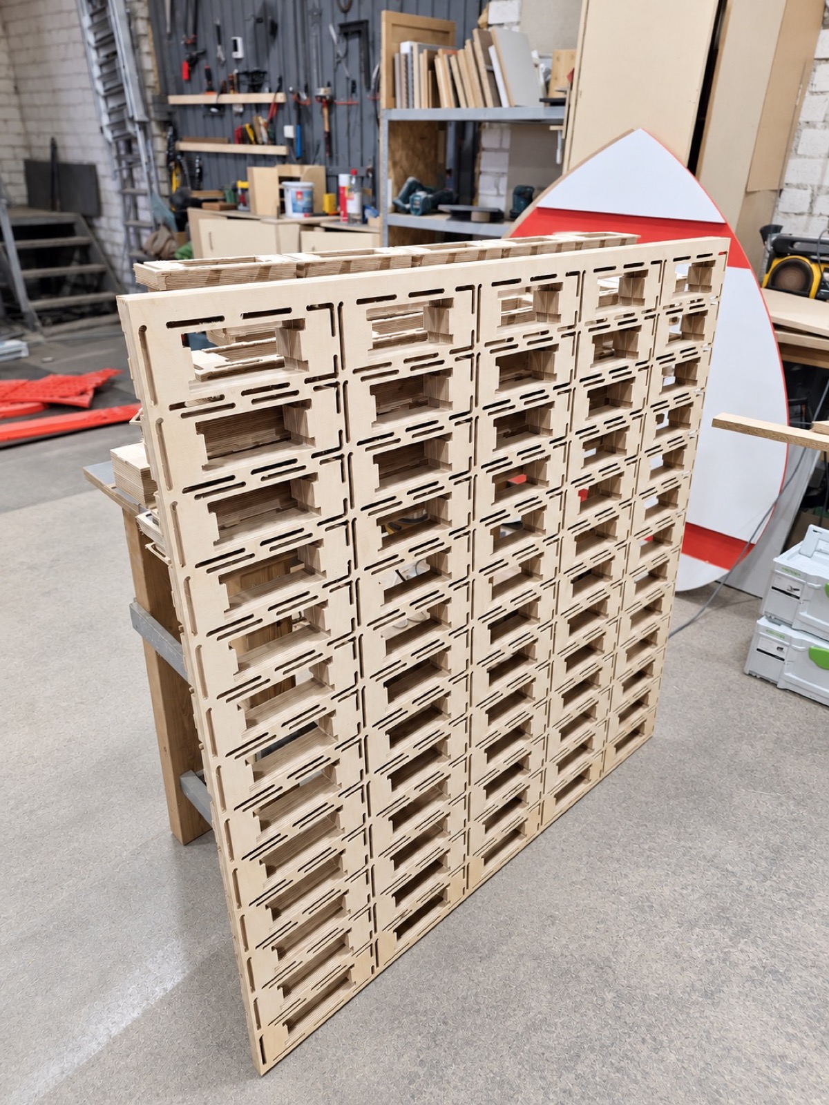 CNC-routed birch plywood panel with slotted joints