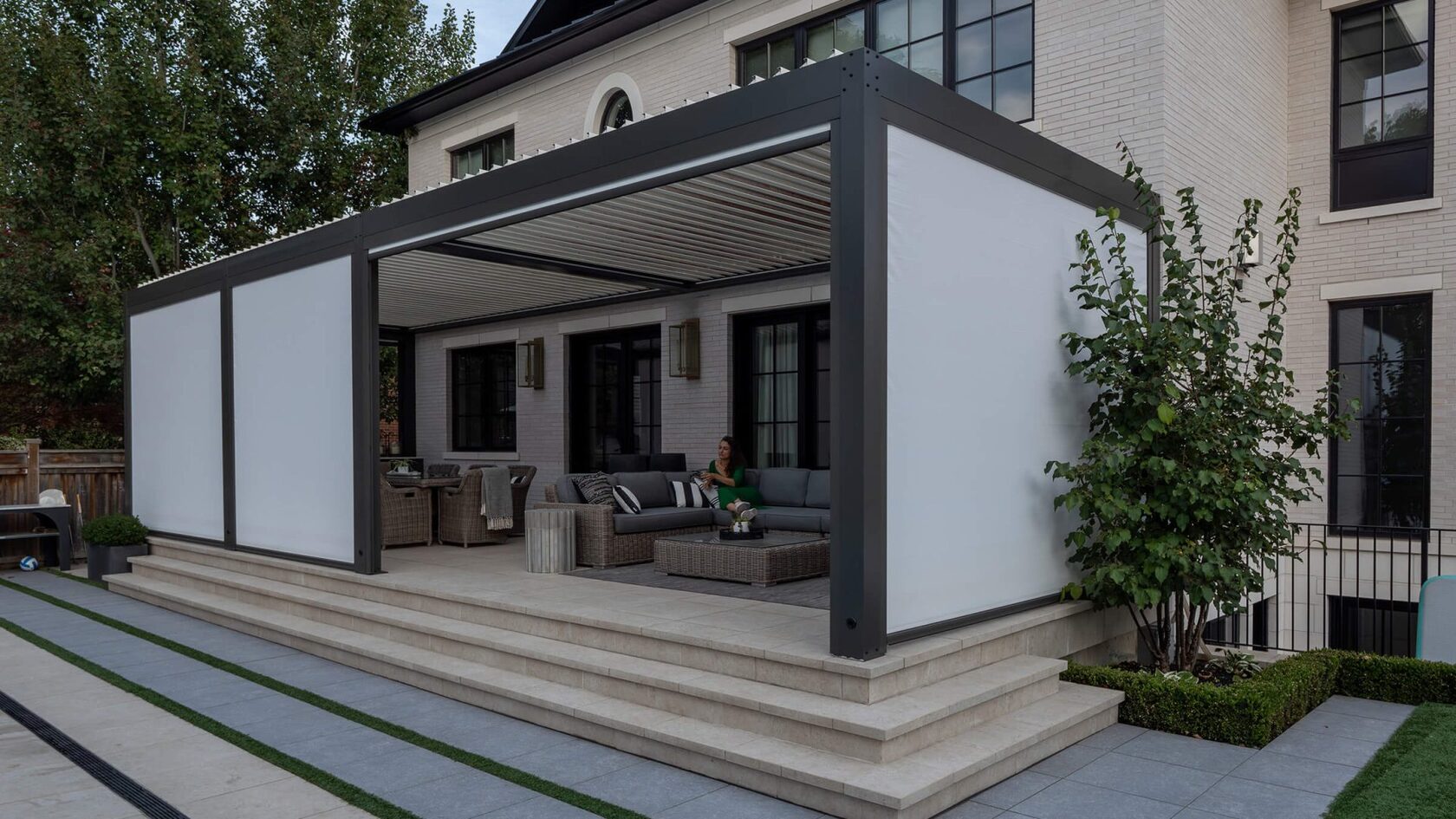 Large aluminum pergola creating an extended outdoor room