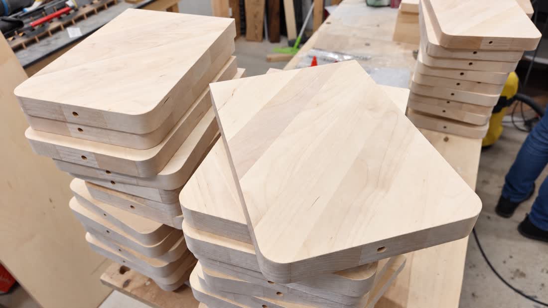 A series of ash tabletops with rounded corners