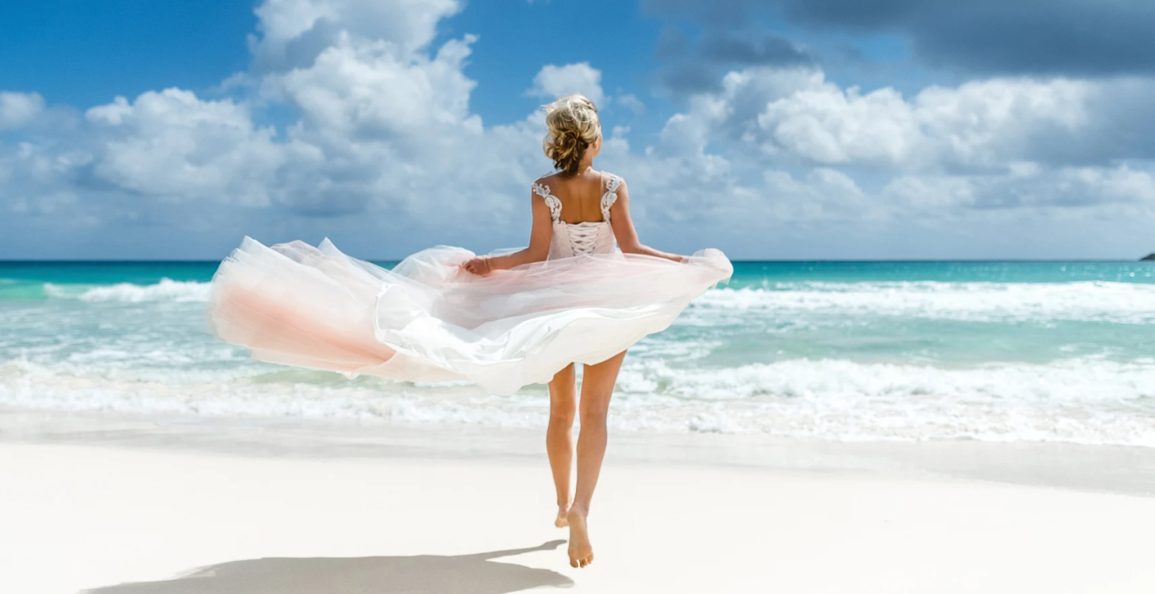 the bride runs by the water