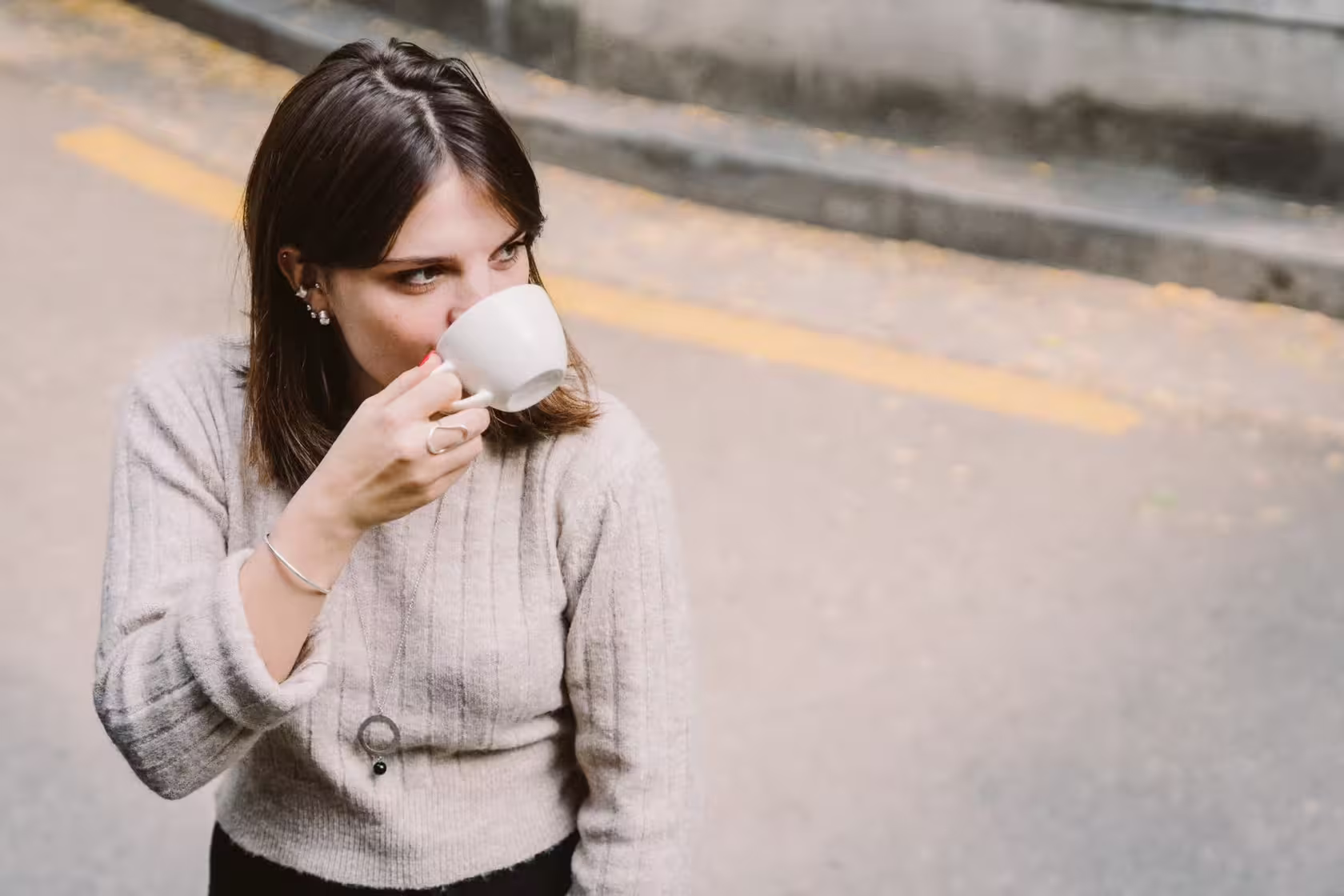 Irina Sharipova is drinking coffee