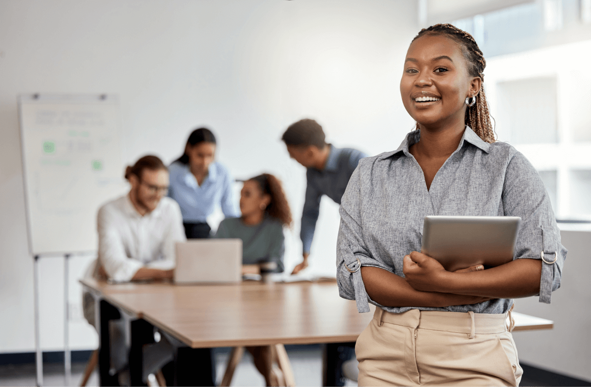 Smile, boardroom and portrait of a black woman with a tablet for training, meeting or teamwork. Happy employees in business and corporate settings efficiently communicate because they have adequate English language skills.