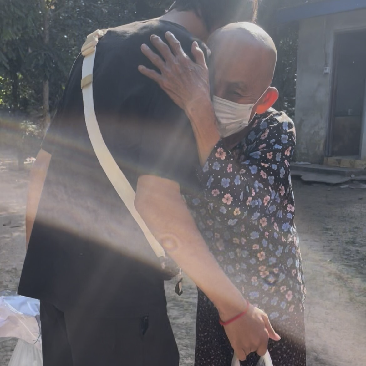 Charity field workers spending time with elderly people
