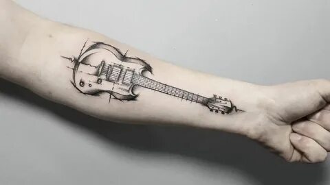 Что означает татуировка гитара