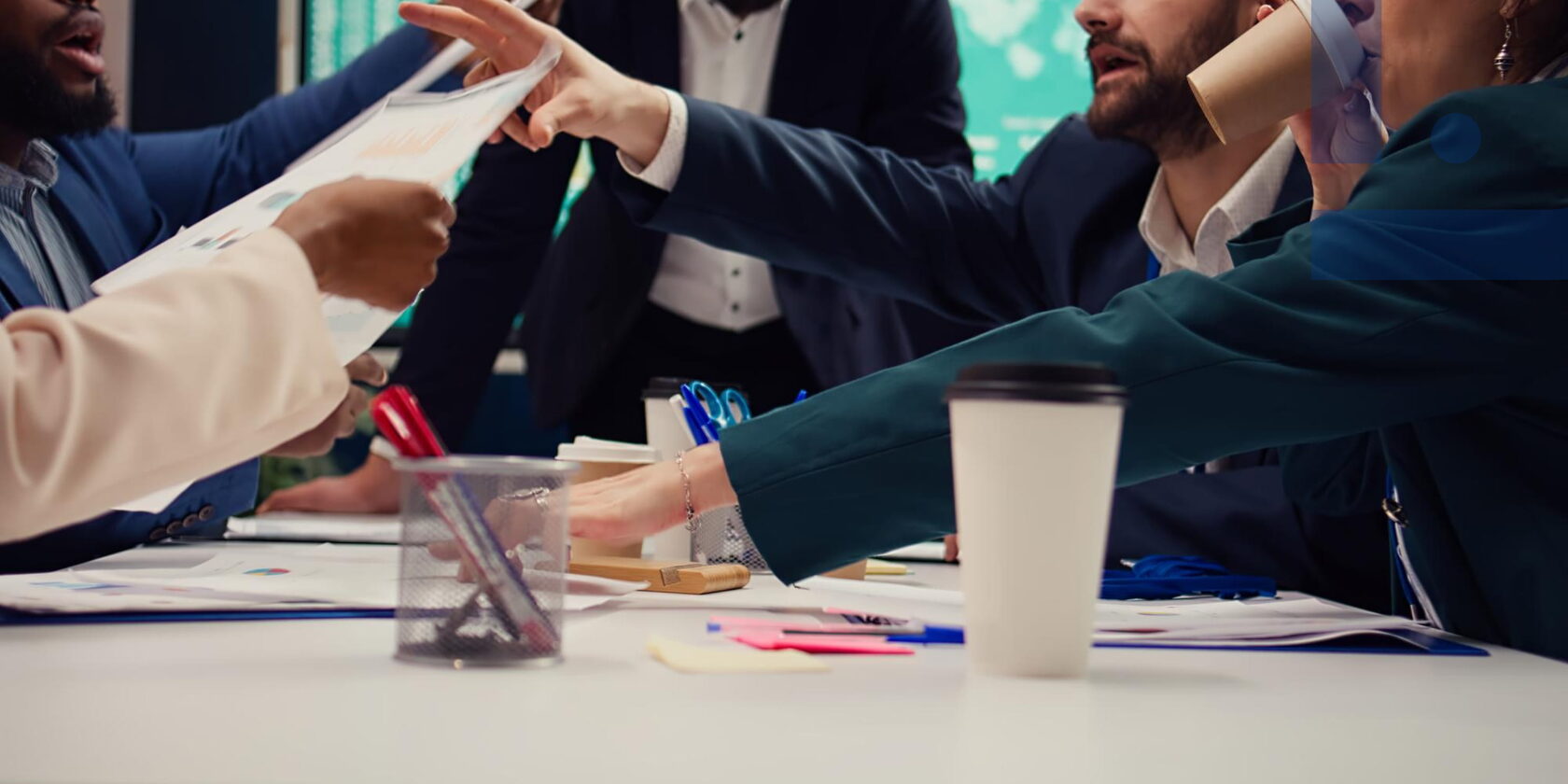 Workplace conflict and destructive behavior: employees arguing during a team meeting, creating tension and communication problems within the team.