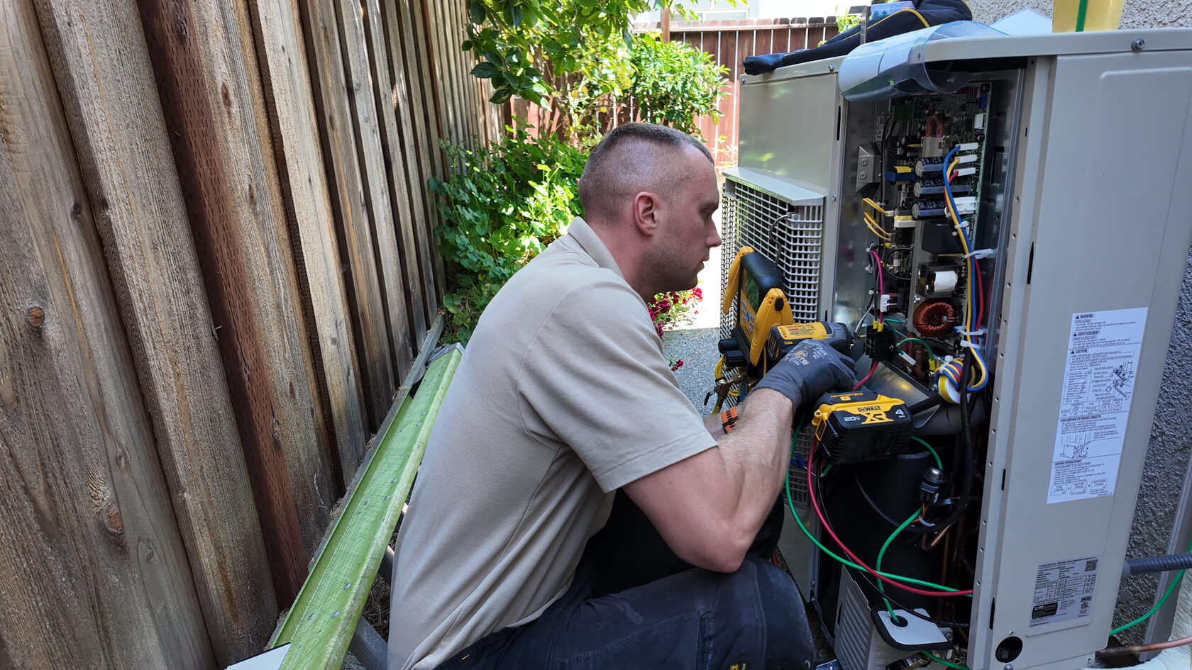 An expert  tries to install central air conditioning unit