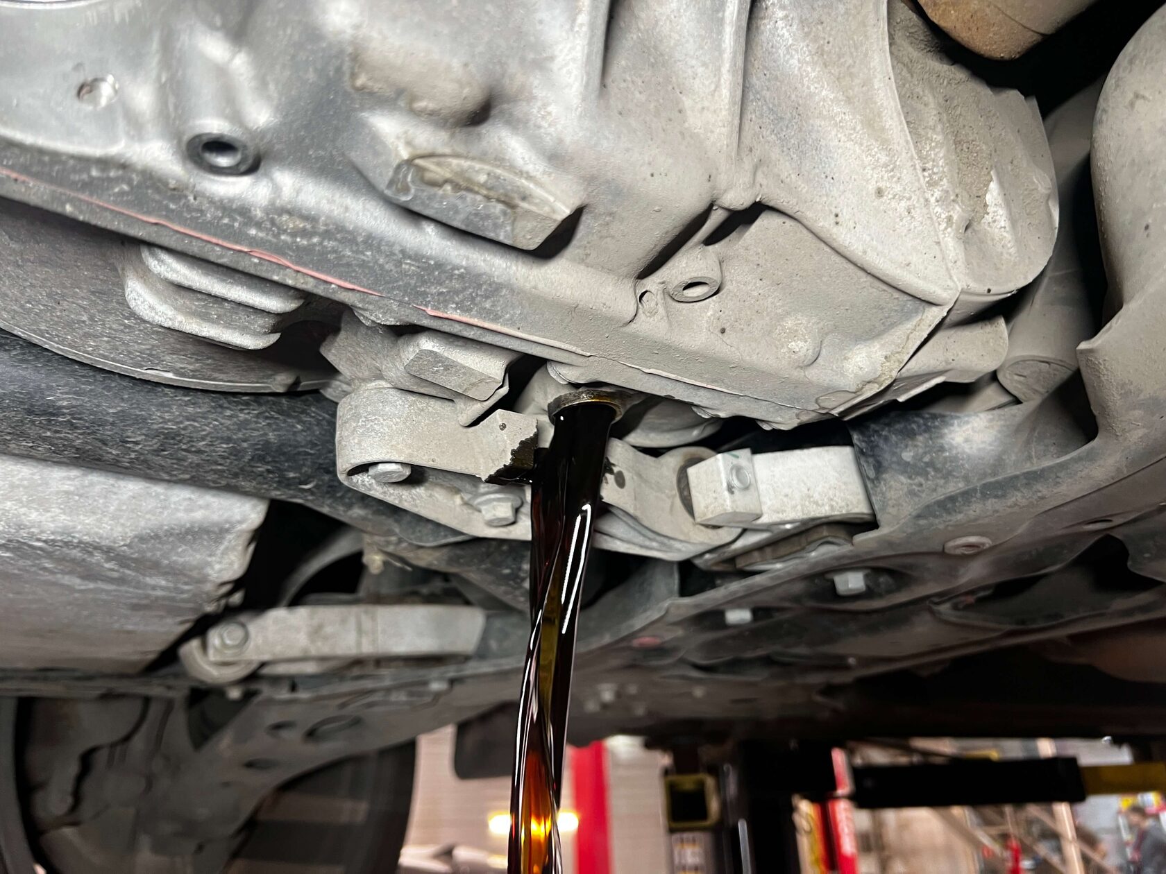 Слив масла из АКПП Geely Monjaro