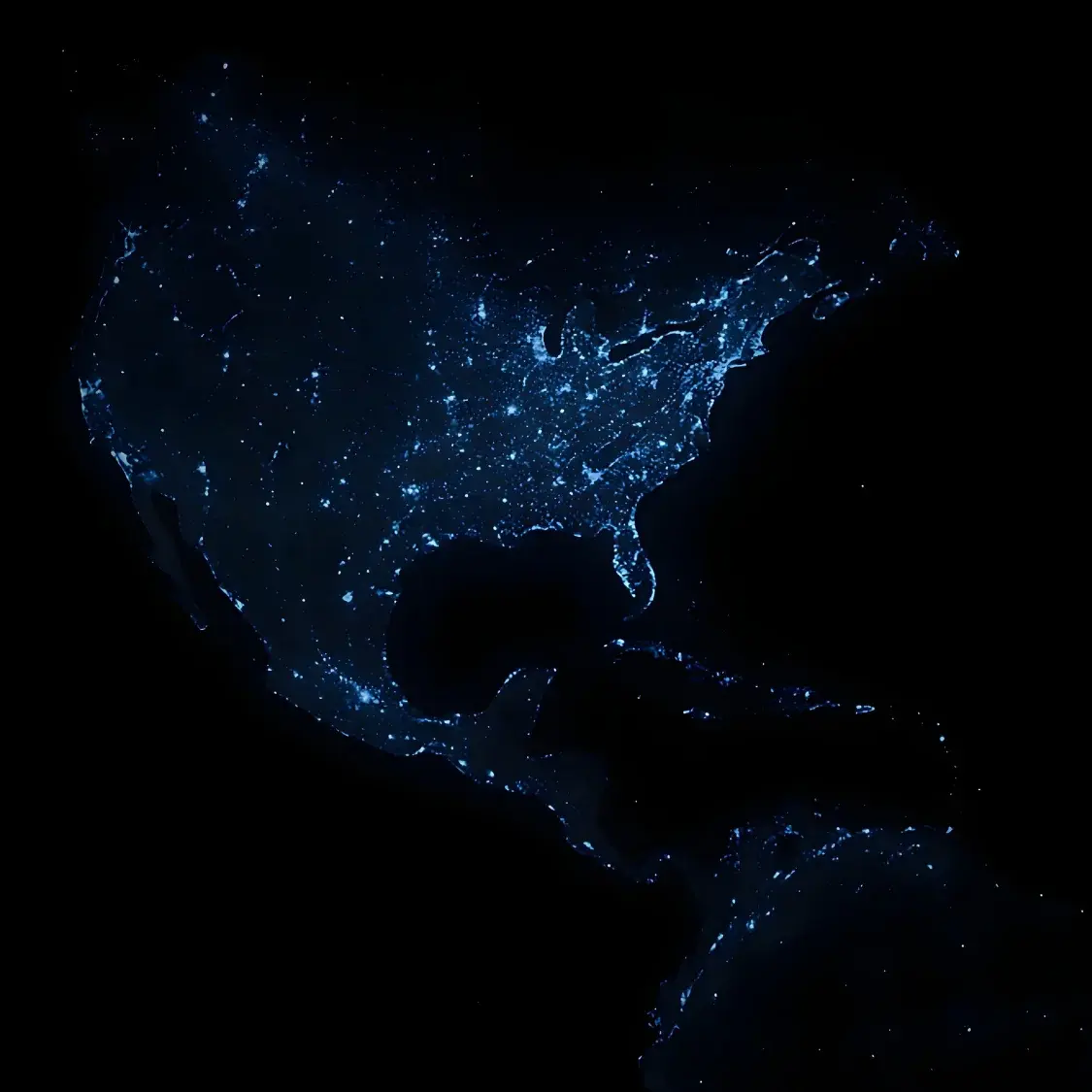 Карта Северной и Южной Америки с огнями городов на тёмном фоне