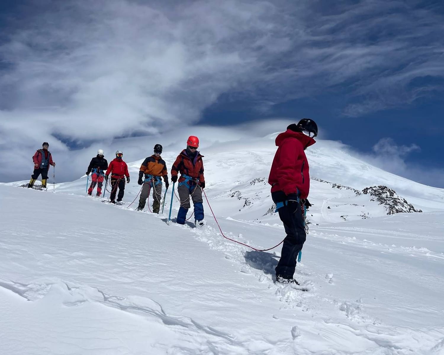 Roped team of climbers on an Elbrus snow slope