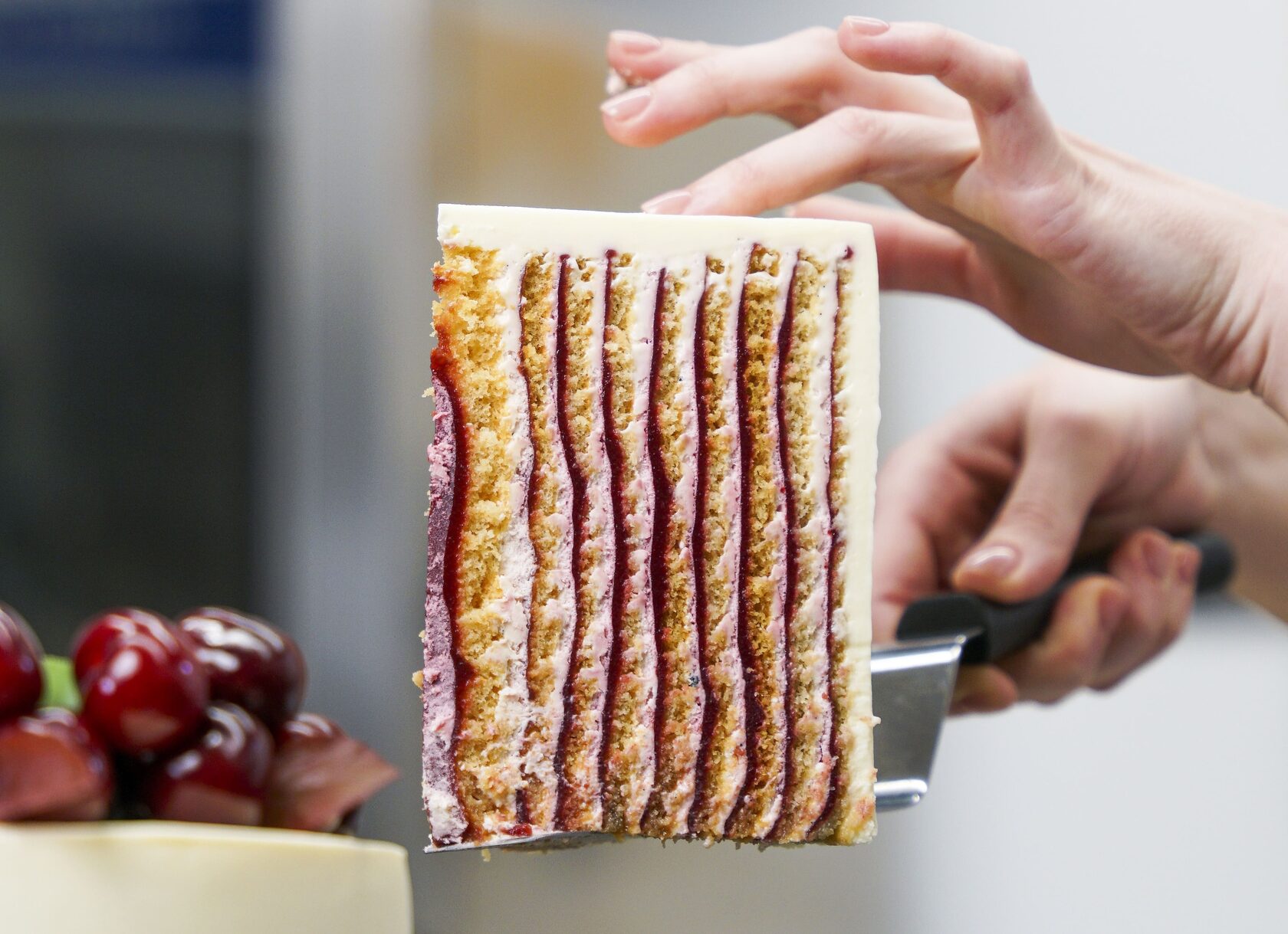 Cherry Velvet vertical layer cake cut photo