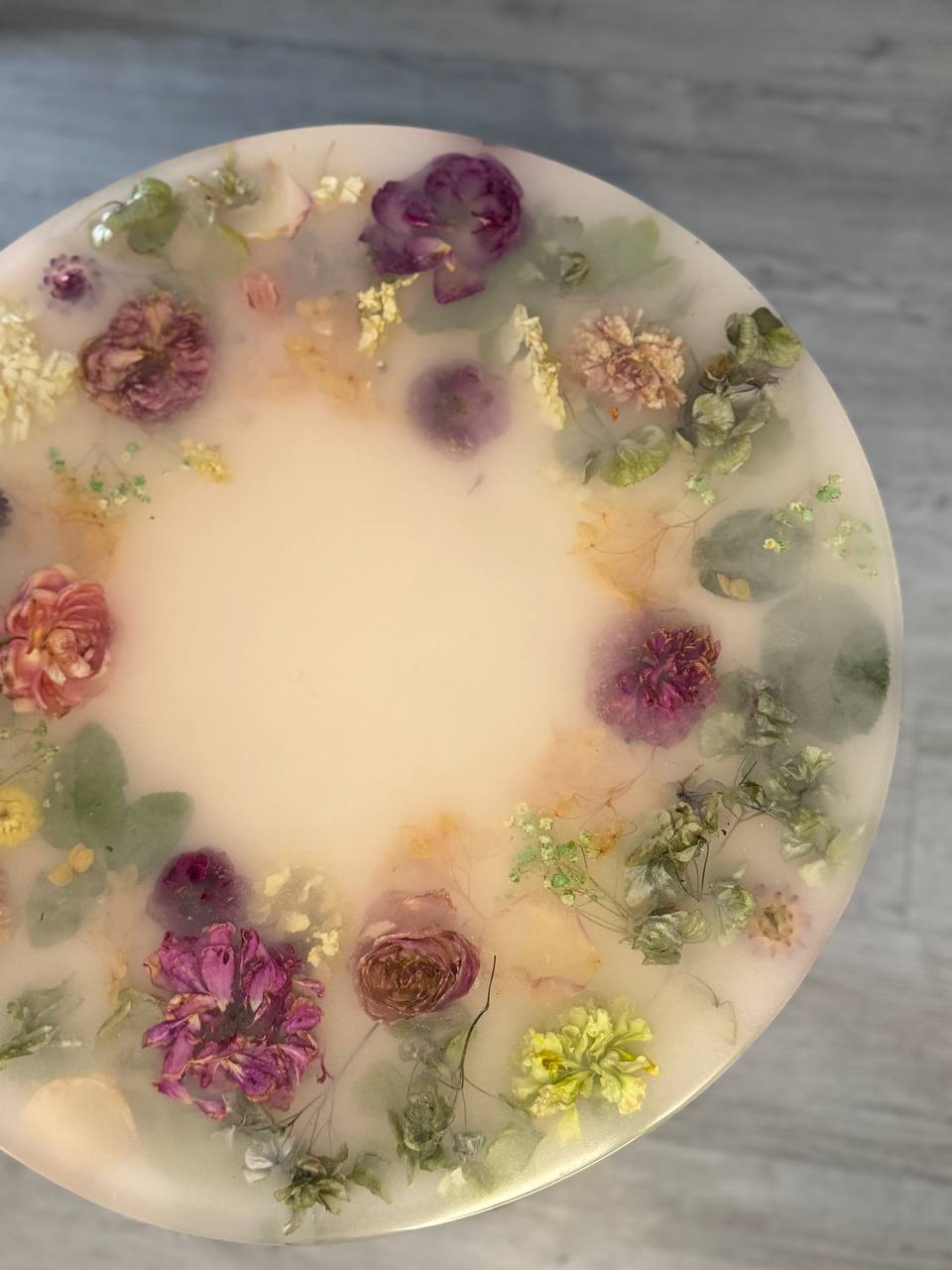 Student holding epoxy table