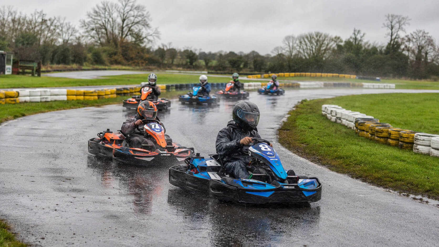 Go karts racing on a wet outdoor track at Athboy Karting Centre in Co. Meath