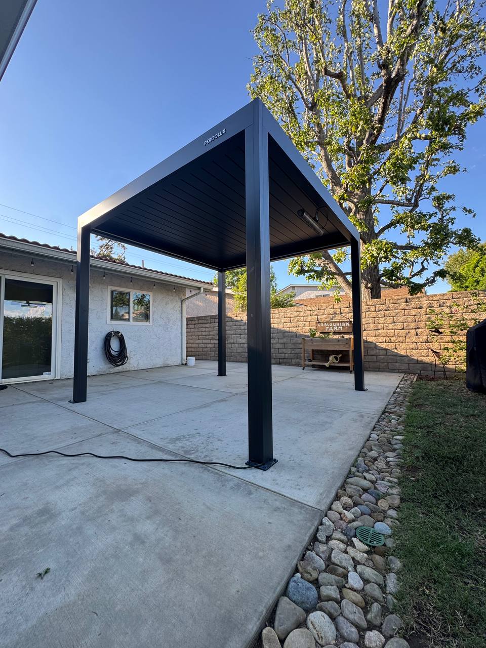 motorized pergola in Costa Mesa with roof closed and integrated perimeter LED lighting