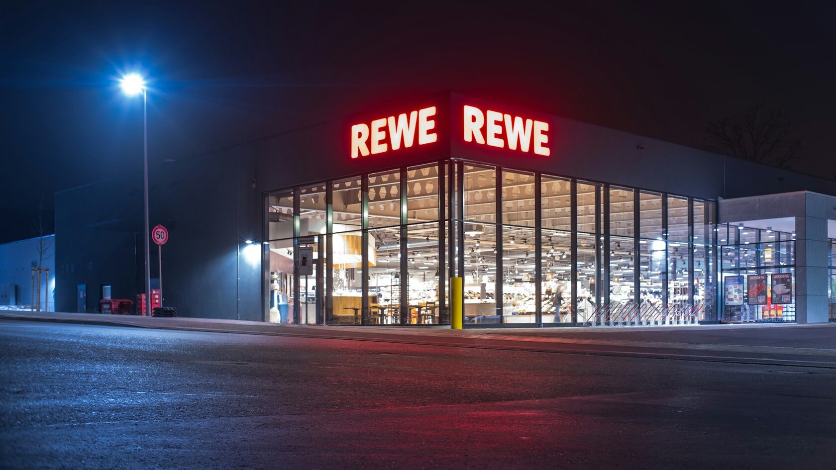 A REWE supermarket at night