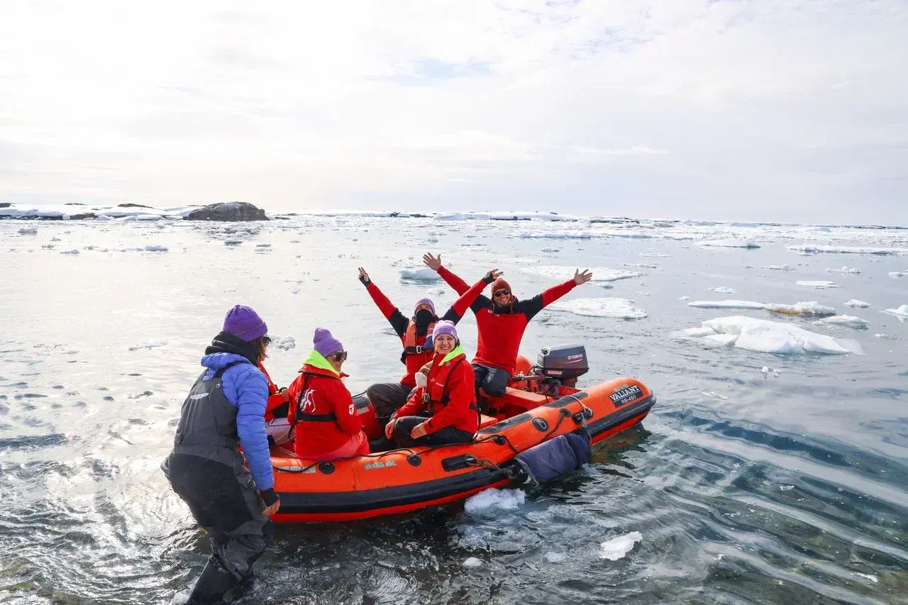 Participants of the MoreTime Expeditions Antarctic Science Camp explore Antarctica by Zodiac navigating through sea ice and floating icebergs. Small boat excursions allow guests to reach remote locations observe wildlife up close and experience the Antarc